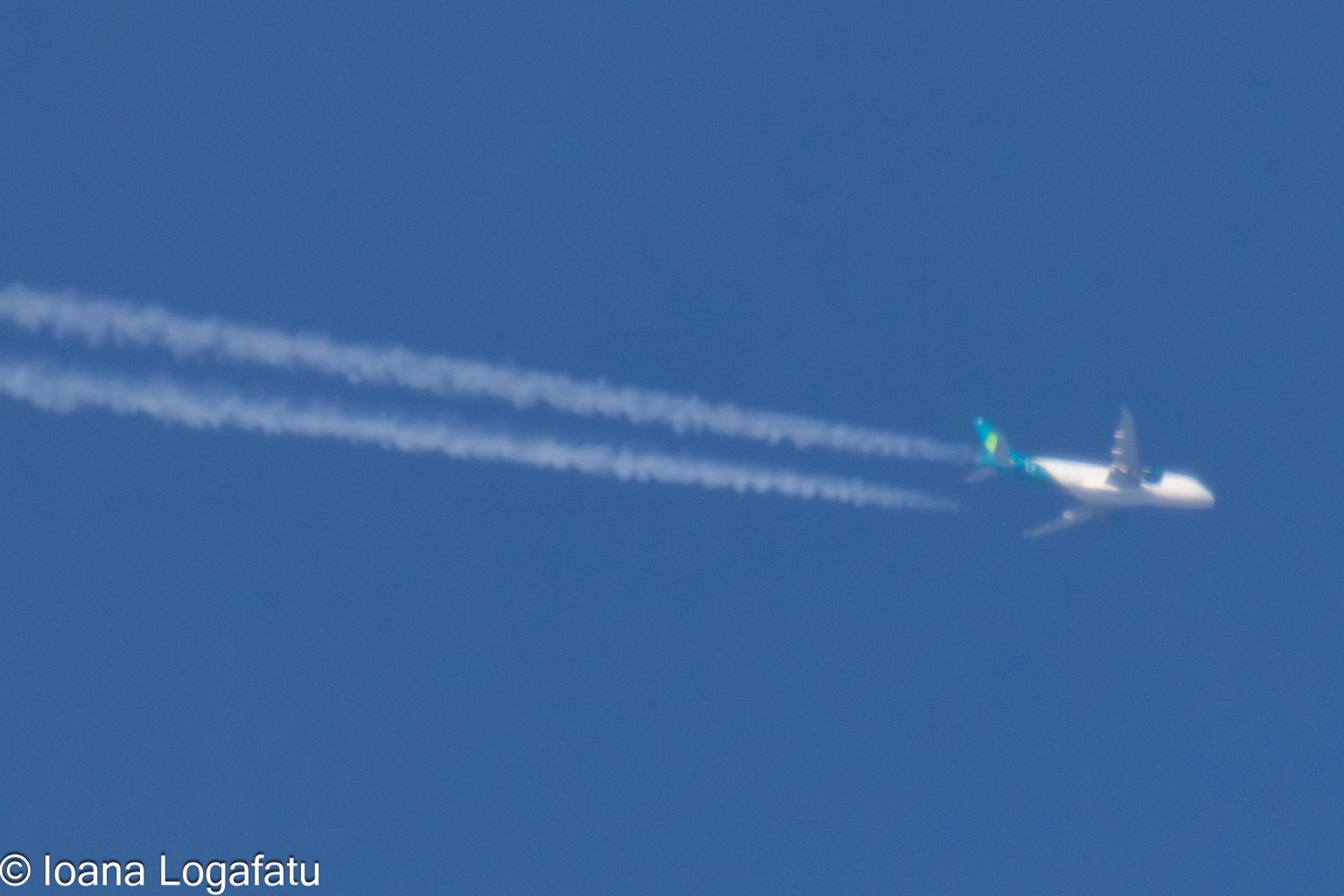 Plane flying in a clear blue sky